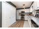 Well-maintained kitchen featuring white cabinets, stainless steel appliances, and modern backsplash at 1005 N Main St, Mount Holly, NC 28120