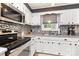 Well-lit kitchen with stainless steel appliances and sleek gray countertops at 1005 N Main St, Mount Holly, NC 28120