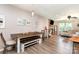 Open floor plan connecting dining area to a living room with a fireplace and comfortable seating at 1005 N Main St, Mount Holly, NC 28120