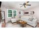 Comfortable living room with hardwood floors, large window, and neutral color palette at 1005 N Main St, Mount Holly, NC 28120