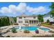 Gorgeous backyard features a pool, spa, mature trees, and lush landscape at 10223 Willingham Rd, Huntersville, NC 28078