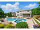 Expansive backyard featuring a pool, spa, and well-maintained landscaping at 10223 Willingham Rd, Huntersville, NC 28078