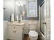 Neat bathroom with a white vanity and shower at 10223 Willingham Rd, Huntersville, NC 28078