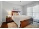Cozy bedroom with a large bed, nightstand, and ample natural light at 10223 Willingham Rd, Huntersville, NC 28078