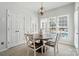 Bright dining area with a round table and views of the pool at 10223 Willingham Rd, Huntersville, NC 28078