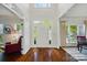 Bright foyer with hardwood floors, high ceilings, and a view of the front door and entry at 10223 Willingham Rd, Huntersville, NC 28078