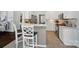 Stylish kitchen featuring white cabinets, stainless appliances, and a breakfast bar at 10223 Willingham Rd, Huntersville, NC 28078