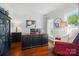 Comfortable home office featuring hardwood floors, natural light, and tasteful decor at 10223 Willingham Rd, Huntersville, NC 28078