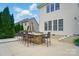 Outdoor stone kitchen with dining space perfect for entertaining or Gathering meals at 10223 Willingham Rd, Huntersville, NC 28078