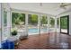 Relaxing screened porch overlooking a sparkling pool and lush backyard oasis at 10223 Willingham Rd, Huntersville, NC 28078