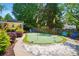 Backyard putting green featuring a sand trap and colorful flags, offering a fun recreational space at 10223 Willingham Rd, Huntersville, NC 28078