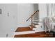 Wooden staircase featuring a dark railing at 10223 Willingham Rd, Huntersville, NC 28078