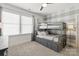 Comfortable bedroom with a built-in bunk bed featuring storage and large windows, perfect for a room at 1148 Wessington Manor Ln, Fort Mill, SC 29715