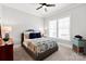 Neutral toned bedroom with a ceiling fan, carpet and nice window light at 1148 Wessington Manor Ln, Fort Mill, SC 29715