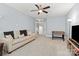 Spacious bonus room featuring a comfortable couch, entertainment center, and foosball table for recreational activities at 1148 Wessington Manor Ln, Fort Mill, SC 29715
