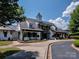 Elegant clubhouse with covered walkways and rocking chairs at 1148 Wessington Manor Ln, Fort Mill, SC 29715