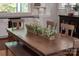 Dining table featuring two green centerpieces in front of butler's pantry at 1148 Wessington Manor Ln, Fort Mill, SC 29715
