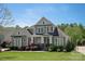 Charming home with manicured lawn, covered front porch, and American flag in a lovely, residential neighborhood at 1148 Wessington Manor Ln, Fort Mill, SC 29715