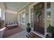 Inviting front porch with swing, decorative wreath, and stylish accents at 1148 Wessington Manor Ln, Fort Mill, SC 29715