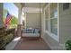 Inviting front porch with a cozy swing, offering a relaxing outdoor space for enjoying the neighborhood views at 1148 Wessington Manor Ln, Fort Mill, SC 29715
