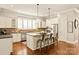 Stylish kitchen with stainless appliances, central island, and sleek countertops at 1148 Wessington Manor Ln, Fort Mill, SC 29715