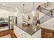 Kitchen island featuring gray countertop with pendant lighting and staircase in the background at 1148 Wessington Manor Ln, Fort Mill, SC 29715