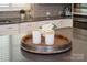 Close-up of kitchen island with decorative tray and modern countertops at 1148 Wessington Manor Ln, Fort Mill, SC 29715