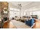 Open concept living area with stone fireplace and seamless flow to dining area at 1148 Wessington Manor Ln, Fort Mill, SC 29715
