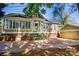 The home's exterior features a mix of neutral siding, brick, and a convenient detached garage at 116 N Mulberry St, Statesville, NC 28677