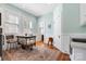 Charming kitchen featuring large windows, a vintage island, and hardwood floors at 116 N Mulberry St, Statesville, NC 28677