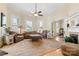 Spacious living room featuring wood floors, crown molding, and a fireplace at 116 N Mulberry St, Statesville, NC 28677
