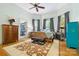 Inviting bedroom with natural light, hardwood floors, and neutral decor at 116 N Mulberry St, Statesville, NC 28677