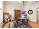 Cozy sitting room featuring wood floors, period chandelier, and decorative furniture at 116 N Mulberry St, Statesville, NC 28677