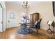 Cozy sitting room featuring wood floors, period chandelier, and decorative furniture at 116 N Mulberry St, Statesville, NC 28677