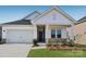 Charming single-Gathering home boasts a manicured lawn and attached two-car garage at 1229 Morehead Dr, Salisbury, NC 28144