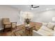 Open living space with hardwood floors, ceiling fan, view to dining, and great natural light at 12536 Hennigan Place Ln, Charlotte, NC 28214