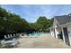 Inviting community pool surrounded by lush greenery and comfortable lounge chairs, perfect for relaxation at 12536 Hennigan Place Ln, Charlotte, NC 28214