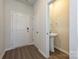 Entryway with half bath featuring pedestal sink and round mirror at 1326 31St St, Conover, NC 28613