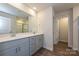Modern bathroom featuring double vanity, a large mirror, and a glass-enclosed shower at 1326 31St St, Conover, NC 28613