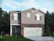 Two-story home with gray siding, brick accents, attached garage, and manicured front yard at 1326 31St St, Conover, NC 28613