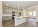 Modern kitchen with gray cabinets, stainless steel appliances, white backsplash, and island at 1326 31St St, Conover, NC 28613