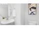 Elegant powder room featuring a modern sink, round mirror, and stylish decor at 134 Rustling Waters Dr, Mooresville, NC 28117