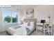 Comfortable bedroom featuring a large window, stylish desk, and a cozy bed at 134 Rustling Waters Dr, Mooresville, NC 28117