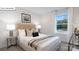 Well-lit bedroom with a neutral color palette, comfortable bed, and ample natural light at 134 Rustling Waters Dr, Mooresville, NC 28117