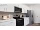 Bright kitchen featuring stainless steel appliances and white countertops at 134 Rustling Waters Dr, Mooresville, NC 28117