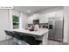 Contemporary kitchen with stainless steel appliances and a large island with seating at 134 Rustling Waters Dr, Mooresville, NC 28117
