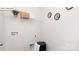 This laundry room features a wire shelf, laundry basket, and washing machine hookups at 134 Rustling Waters Dr, Mooresville, NC 28117