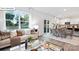 Open concept living room and dining area filled with natural light at 134 Rustling Waters Dr, Mooresville, NC 28117