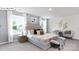Bright and inviting main bedroom featuring stylish decor, large windows, and cozy seating at 134 Rustling Waters Dr, Mooresville, NC 28117