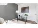 Well-lit home office featuring a glass desk, comfortable chair, and a neutral color scheme at 134 Rustling Waters Dr, Mooresville, NC 28117
